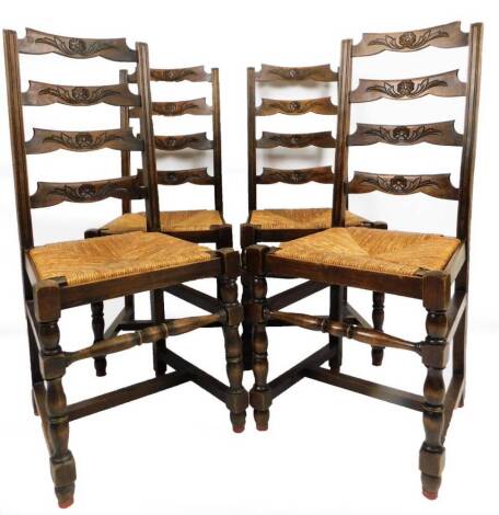 A set of four ladder back rush seated dining chairs, on turned front legs joined by a turned stretcher, 108cm H. (4)