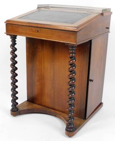 A late 19thC rosewood Davenport desk, with three part pierced metal gallery top, tooled leather slide, fitted interior, side drawer and cupboard and front barleytwist supports joined by a platform base, 82cm H, 56cm W, 53cm D.