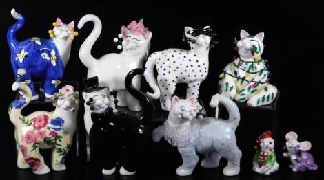 Various Lacombe pottery comical cat ornaments, to include figure wearing shades, predominately black and white colour way, 17cm H, another floral example, etc. (a quantity)