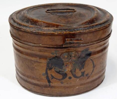 A late 19thC hat tin box, of oval form, with heavy clasp, partially initialled, with swing handle, 37cm W.