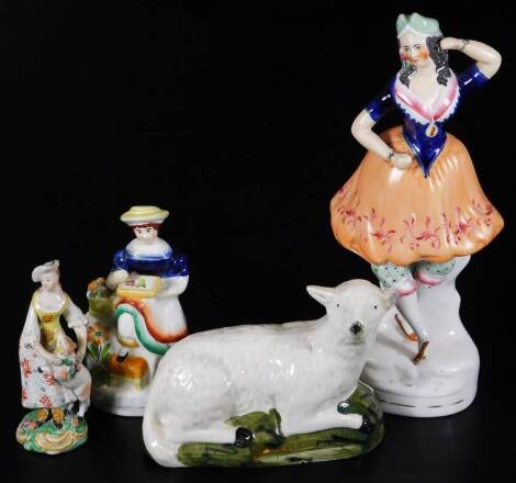 A 19thC Staffordshire pottery figure group, of a recumbent sheep, 13cm H, (hollow), a Victorian Staffordshire figure, early 19thC Pearlware figure of a lady in flowing robes aside lamb, another Staffordshire figure of a dancing lady. (4)