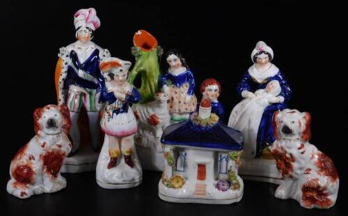 Various 19thC Staffordshire pottery figures, to include pastille cottage, polychrome decorated predominately in brown, pink and orange, 12cm H, a figure nursing child, a pair of miniature Staffordshire spaniels, figure holding mask, child spill group, fur