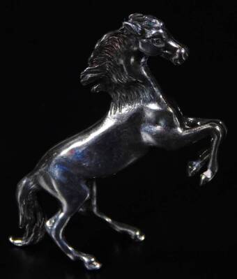 An Elizabeth II silver figure of a prancing horse, London 1985, 4cm H, 1½oz.