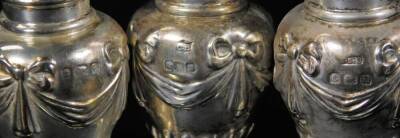 A set of three George V silver pepper pots, each with domed lids, shouldered circular bodies, inverted stems and circular feet, Birmingham 1912, 7cm H, 1½oz. (3) - 2