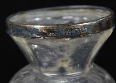 A dressing table jar, of shouldered square form, with silver lid, 14cm H, a cut glass salt with silver top and a vase of bellied form with silver collar. (3) - 3