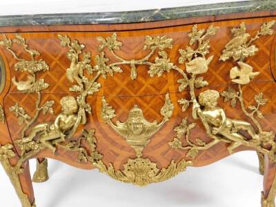 A Louis XIV style French kingwood and gilt metal mounted commode, after the model by Charles Cressant, of serpentine bombe form, the green veined marble finish top raised above a heavily cast body, set with figures, scrolls, cherubs and fronted by two dra - 3