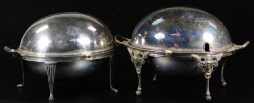 Two Edwardian silver plated chafing dishes, of oval form with articulated lids and removable inserts, the first with shaped handles on fluted legs and hairy paw feet, the second with mask headed legs on orb feet, 36cm W, etc. (2)