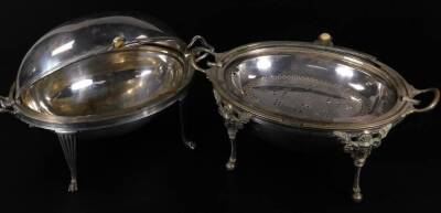 Two Edwardian silver plated chafing dishes, of oval form with articulated lids and removable inserts, the first with shaped handles on fluted legs and hairy paw feet, the second with mask headed legs on orb feet, 36cm W, etc. (2) - 2