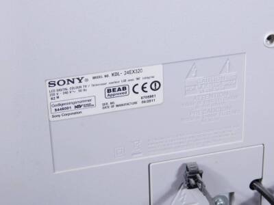 A Sony Bravia LCD digital 21 inch television, in white trim with remote control and wire. - 2