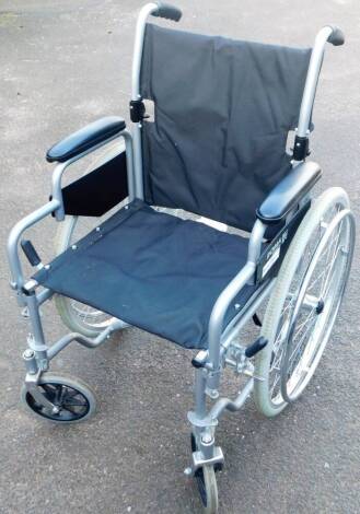 A folding Roma Medical wheelchair, 93cm H.