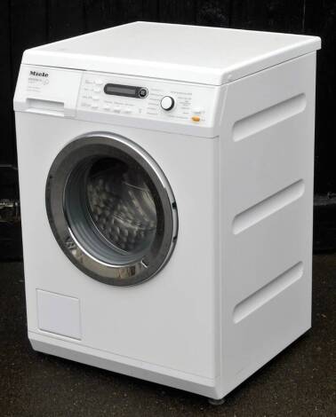 A Miele Edition 111W5877 washing machine, 88cm H, 61cm W, 59cm D.