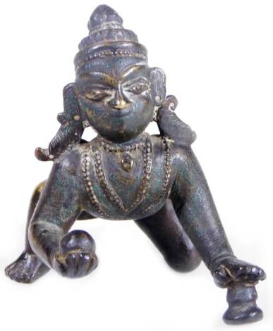 A Chola bronze figure of Krishna, modelled crawling with a butter ball, 6cm L.