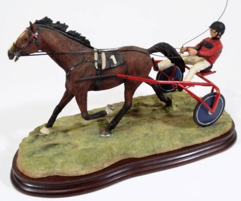 A Border Fine Arts figure Trotter, no. B08636, on wooden plinth, signed J F HB, 23cm H.