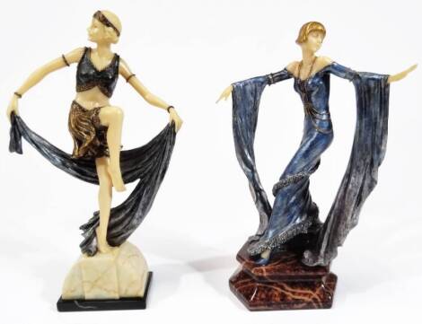 An Art Deco type figure of a lady, on shaped base, wearing flowing robes, predominately in blue and brown, 25cm H and another similar. (2)