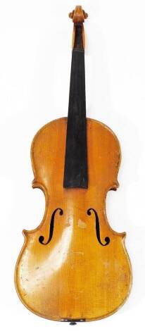 An early 20thC pine and walnut cased violin, with two piece 31cm back and ebonised mounts, 50cm overall.