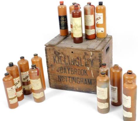 A wooden Killingley Nottingham box, containing a quantity of stoneware bowls and alcohol flagon flasks, many with lids, the box 39cm H, 45cm W, 35cm D.