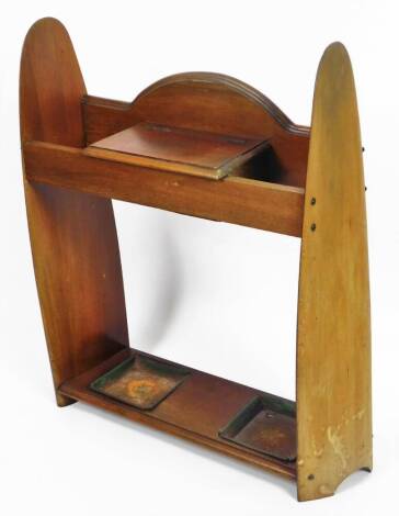 A 20thC mahogany aeroplane propeller stick stand, with propeller ends, central glove box and metal lined sections beneath, with an open back, 85cm H, 65cm W, 24cm D.