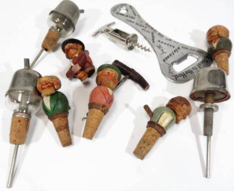 Various Scandinavian carved wooden cork stoppers, bottles stoppers, etc. to include articulated examples, gentleman with moustache holding bottle, 9cm H, other carved examples, chrome plated corkscrew, an enlarged bottle opener a toast to the host, etc. 