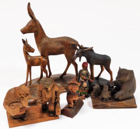 A 20thC Black Forest type carved bear group, formed of three bears, naturalistic stand, 16cm W, various other carved Black Forest type and Scandinavian figure groups, stag, etc. (4)