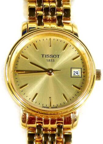 A Tissot gent's wristwatch, on gold coloured stainless steel strap, with gold coloured dial and date aperture, numbered T525/925, boxed.