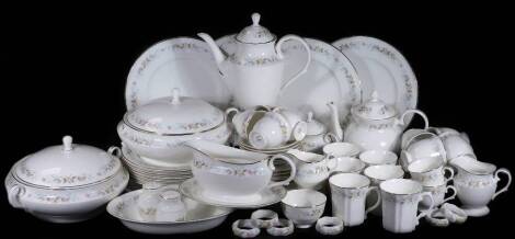 A comprehensive Mayfair bone china dinner service, decorated with flowers, to include a pair of lidded tureens, 31cm W, napkin rings, gravy boat, open vegetable dish, dinner plates, side plates, bread and butter plates, soup bowls, cups, saucers, part cru