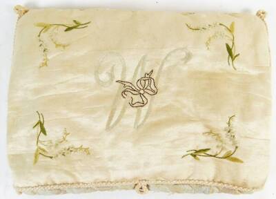 A 19thC embroidered foot warmer, of cushion form, with tasselled edge, initialled M, in the style of Manners Belvoir Castle, with floral spandrels on a cream ground, 41cm W.