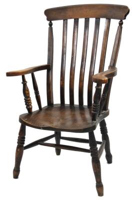 A stripped ash and elm grandfather chair, with comb top, lath back, scroll arms, shaped seat and ring turned forelegs joined by an elaborate baluster double stretcher, 113cm H.