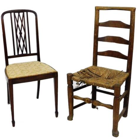 A 19thC ash and elm rush seated chair, with ladder back, turned front legs, joined by a turned stretcher and an Edwardian mahogany dining chair. (2)