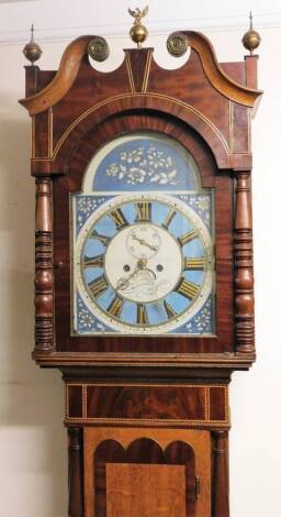 A 19thC oak and mahogany longcase clock, the swan neck pedimented hood surmounted by an urn and eagle finial, flanked by two further urn finials, above half carved columns and a shaped long trunk door, with crossbanding and shell patera, above an oval pan