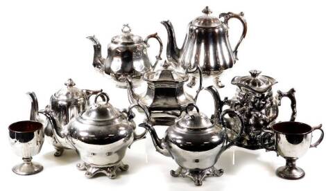 A small collection of Victorian and later silver lustre earthenware teapots and cups. (9)