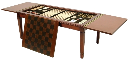 A 20thC teak game/coffee table, with chequerboard top on square tapering legs, terminating in spade feet, with various gaming pieces, 43cm H, 100cm W, 50cm D.