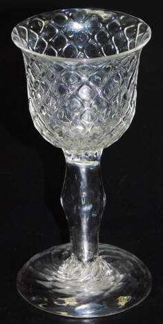 A rare mid 18thC hollow stem goblet, with moulded honeycomb campana shaped bowl, raised upon a domed, honeycomb foot, 18cm H.