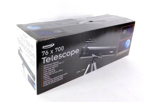 A Zennox solid refractor night telescope, 76 x 700, black cased, with tripod and instructions, boxed.