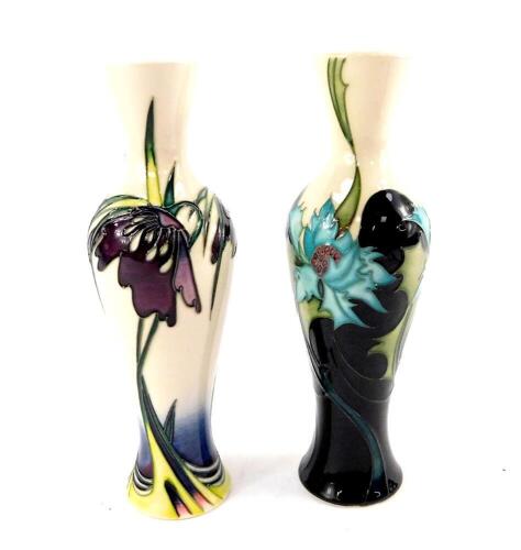 Two Moorcroft pottery vases decorated in the Persephone and Sea Holly patterns,, of slender baluster form, Moorcroft Collector's Club edition 2007, the other 2006, painted and impressed marks, 20cm H.