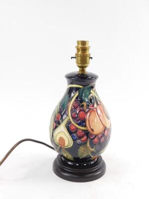 A Moorcroft pottery ovoid lamp decorated in the Queens Choice pattern, with lamp shade, 22cm H.  - 2