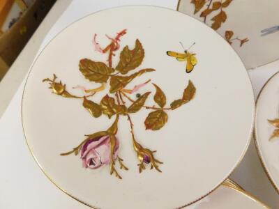 A late 19thC Bodley porcelain dessert service, moulded and painted with blossom, butterflies and insects, pattern no 4/9804, printed, painted and impressed marks, comprising a pair of comports, four tazze and twelve plates. - 4