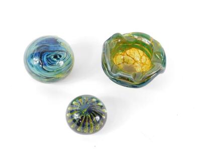 A Mdina glass paperweight, with swirl decoration, 11cm Dia, another decorated with a sea urchin, 8cm Dia, and an ashtray, etched mark, 16cm Dia. (3) - 2