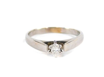 A marquise cut diamond solitaire ring, the marquise stone measuring approx 4.2mm x 3mm x 2.4mm, totalling approx 0.25cts, in six claw setting, with open design shoulders, on a plain polished band, unmarked white metal, ring size O, 2.8g all in.