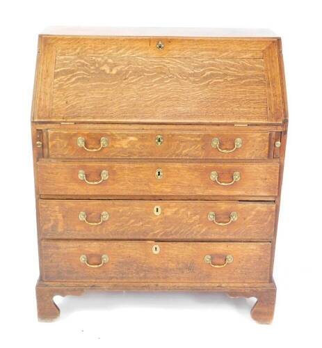 A George III oak bureau, with fall flap over four drawers, swan neck handles and bracket feet, 110cm H, 92cm W, 50cm D.