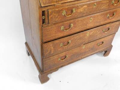 A George III oak bureau, with fall flap over four drawers, swan neck handles and bracket feet, 110cm H, 92cm W, 50cm D. - 3