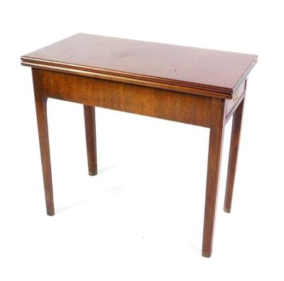 A George III mahogany tea table, with rectangular fold over top, raised on square taper legs, 72cm H, 81cm W, 42cm D..