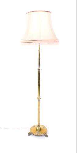 An early 20thC brass standard lamp, converted to electricity, 182cm H.