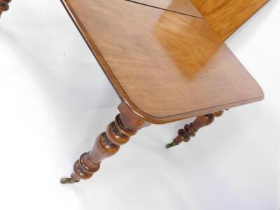 A Victorian mahogany wind out dining table, with moulded top, one additional leaf, raised on turned legs, brass capped on castors, 122cm W, 135cm L + 56cm leaf. - 3