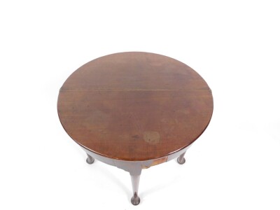 A George III mahogany demi lune tea table, with a fold over top, raised on turned legs and pad feet, 75cm W. - 4