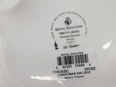 Four Royal Doulton figures, boxed with certificates, comprising Christmas Day 2005, HN4723, Christmas Day 2010, HN5379, Christmas Day 2008, HN5209, and Christmas Celebration, HN47221. - 2