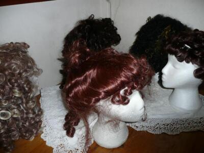 A good quantity of theatrical wigs - blacks