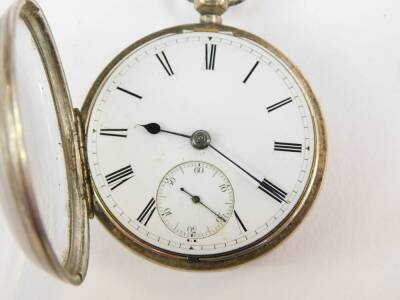 A late 19thC silver half hunter pocket watch, with white enamel dial, seconds dial and blue hands, key wind in a silver casing, bearing initials to back R J? rubbed, London Assay 1877, no 23270, stamped RJP, with enclosed movement stamped Dancaster Bell - 2