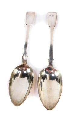 A pair of Victorian silver fiddle pattern serving spoons, both initialled 'AP', London 1841 and 1845, 3.97oz.