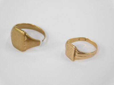 Two 9ct gold signet rings, one cut and bearing rubbed initials, the other of smaller proportions, with rubbed overall design, size M, 7.7g. - 2