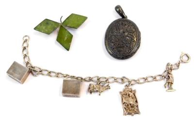 Three items of silver jewellery, comprising a silver locket, with floral etched design, a three leaf silver brooch, set with three pale green stones, and a silver charm bracelet on plain curb link chain, with two money charms, a cow, locket and a worker.